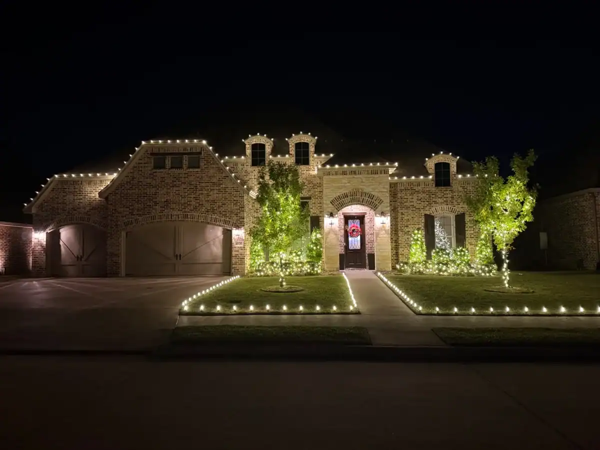 Warm-white Christmas roofline and walkway lights installed by SETX Christmas Lights